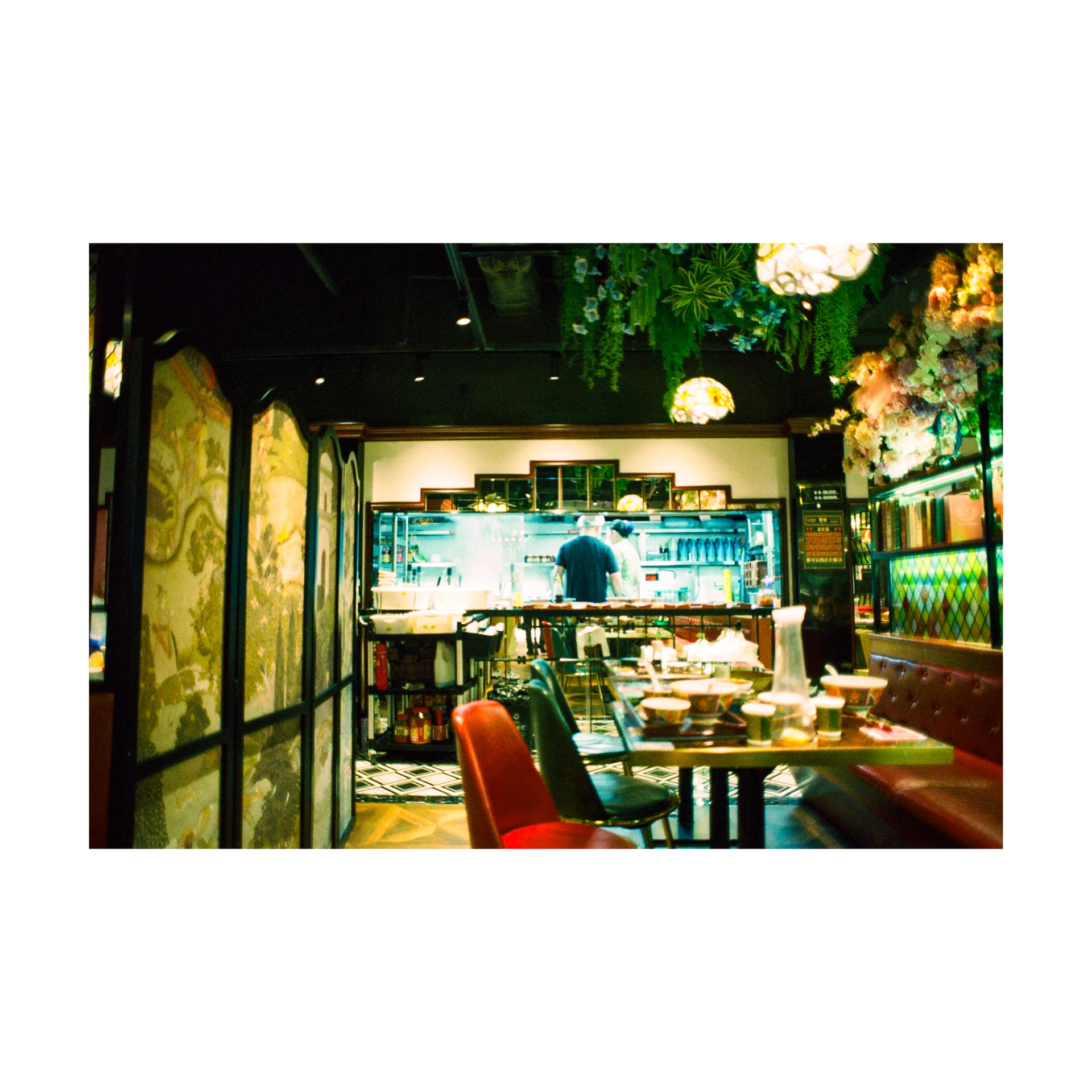 Tables and chairs in a dimly lit restaurant