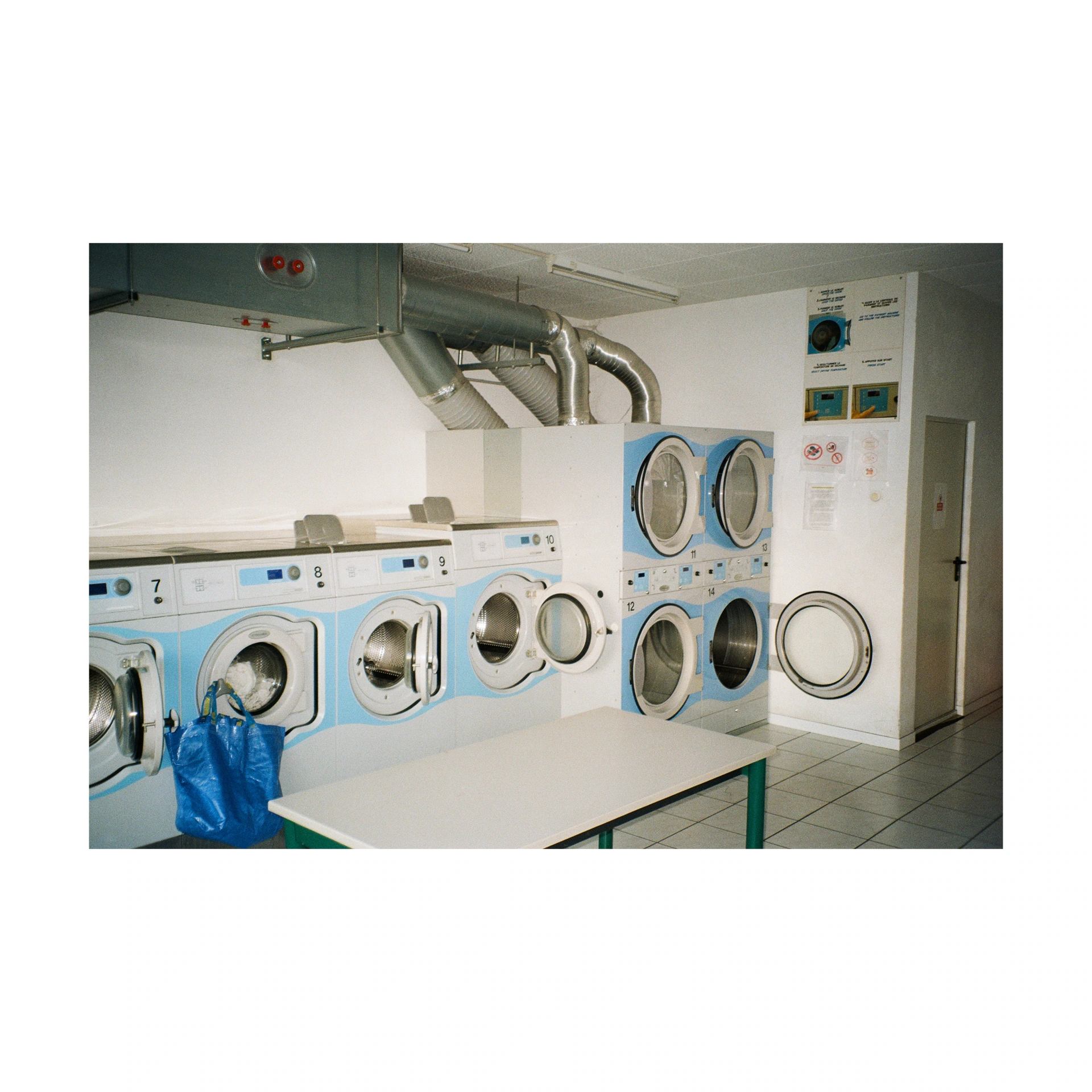 Rows of washing machines in a laundrette
